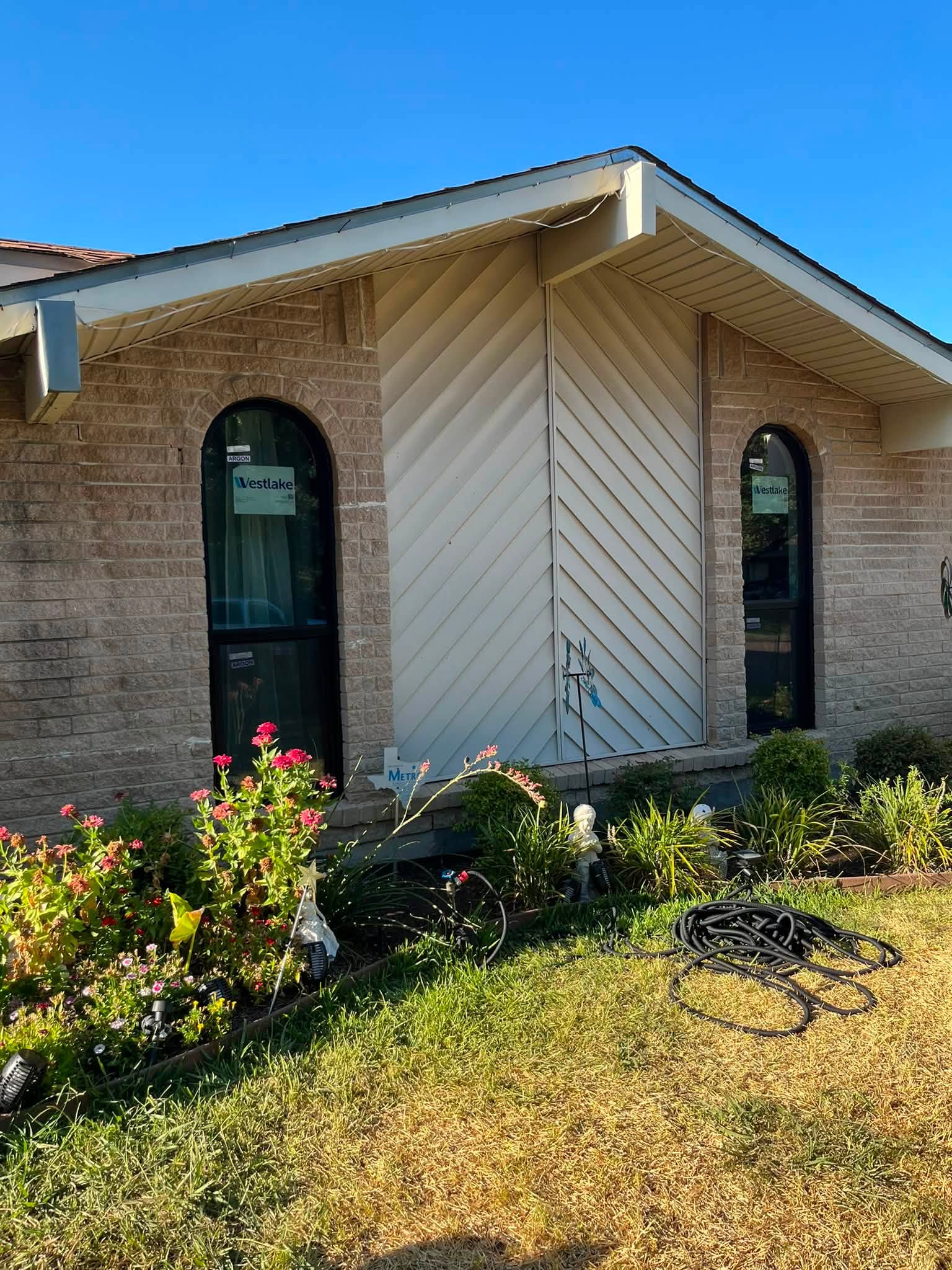 Full-home window replacement project, arched entry window